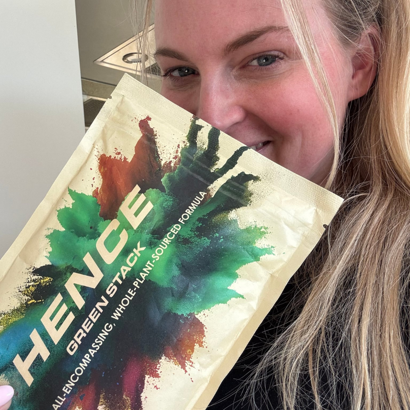 Person holding a product package with 'Hence' branding