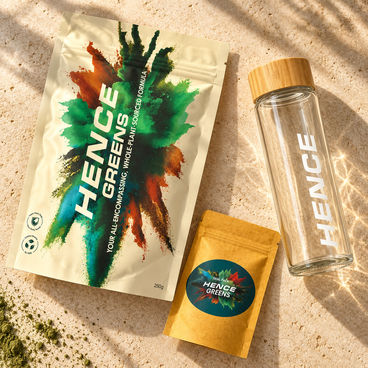 Daily Greens pouch, glass bottle and trial / travel pouch laid flat on stone; packaging concept
